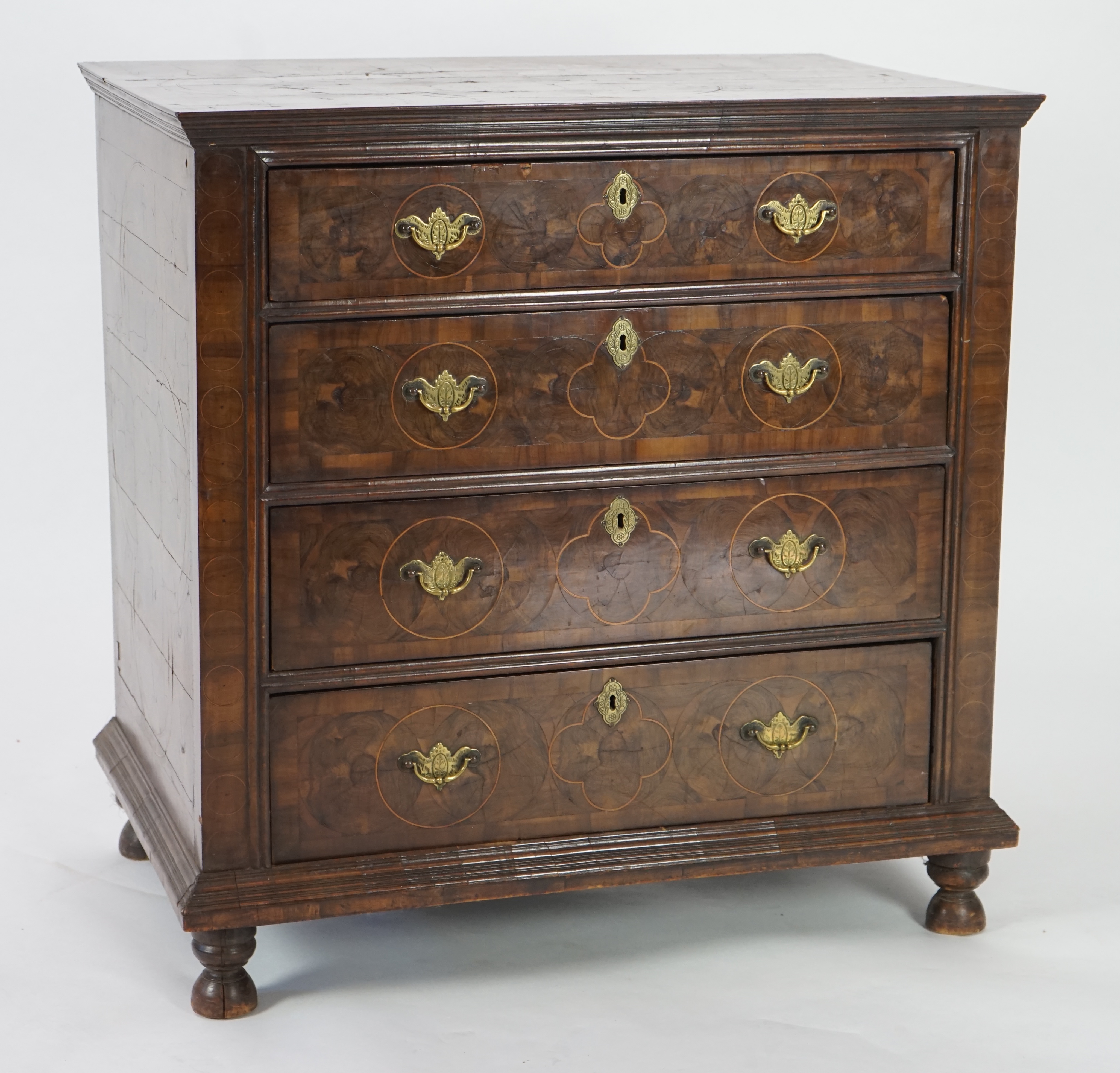 A William and Mary oyster veneered laburnum and walnut chest